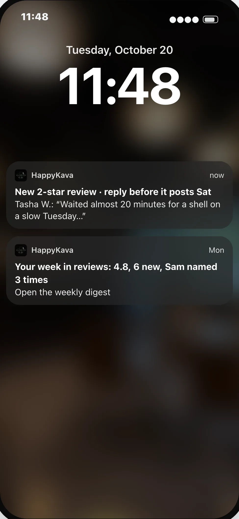 An owner's lock screen: a new two-star review to answer before it posts.